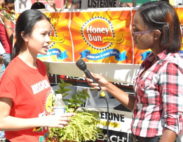 Laurian Lue Yen ’10 speaks with the media about "Brush Up Jamaica"