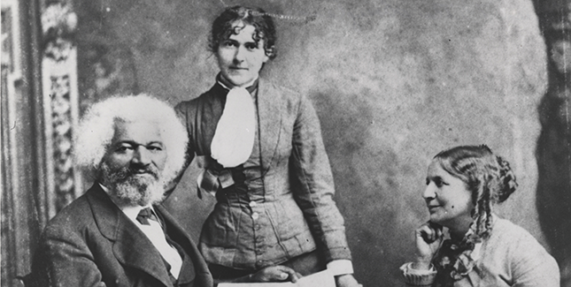Frederick Douglass with Helen Pitts Douglass (seated, right) and her sister Eva Pitts (standing, center). 