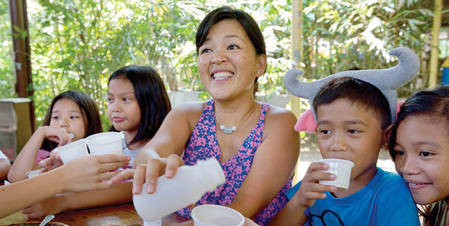Marie Cavosora ’91 with children at Calaboo Creamery