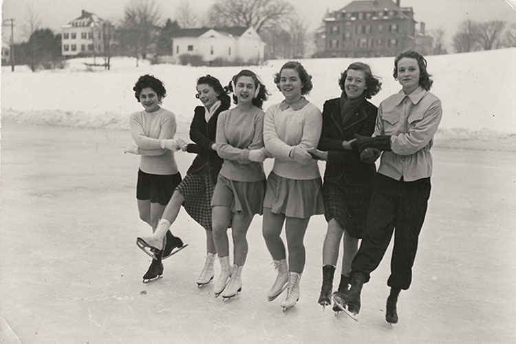 Six students ice skate on Lower Lake, circa 1945–1956.