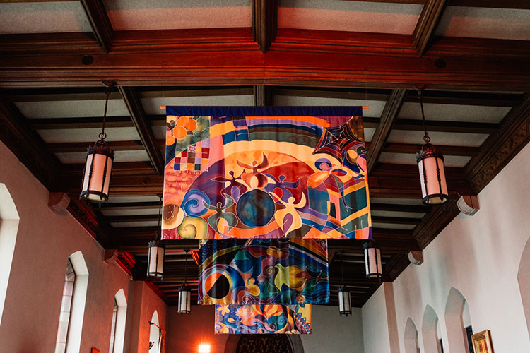 Three colorful horizontal banners hanging from the ceiling.