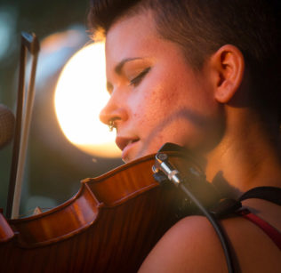 Zoe Darrow plays her Celtic fiddle.