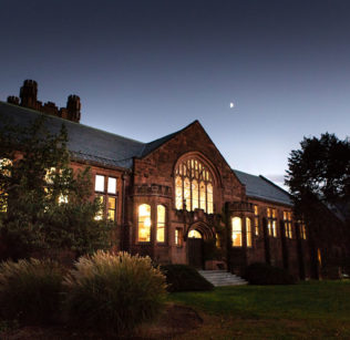 The library as seen at night from outside on College Street.